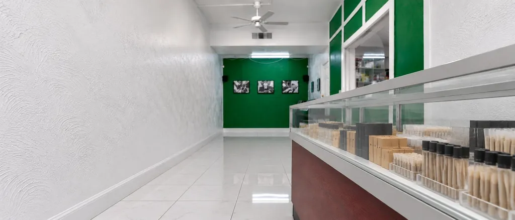 Pre-roll tubes and packs in a glass display case at Kush Kingdom