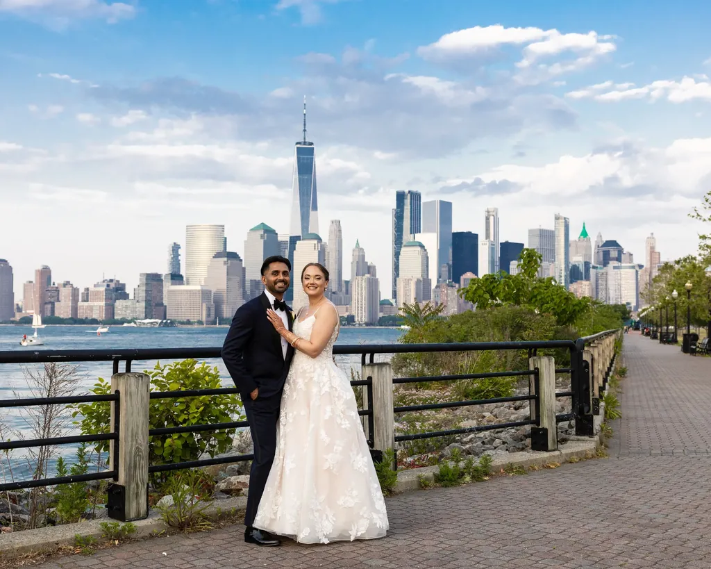 Couple on the waterfront with the Manhattan skyline behind them