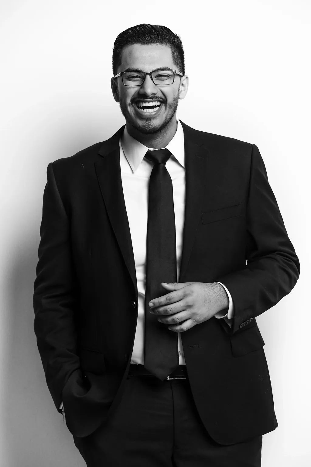 Jay Verma, founder of Verma Photography, in a black suit