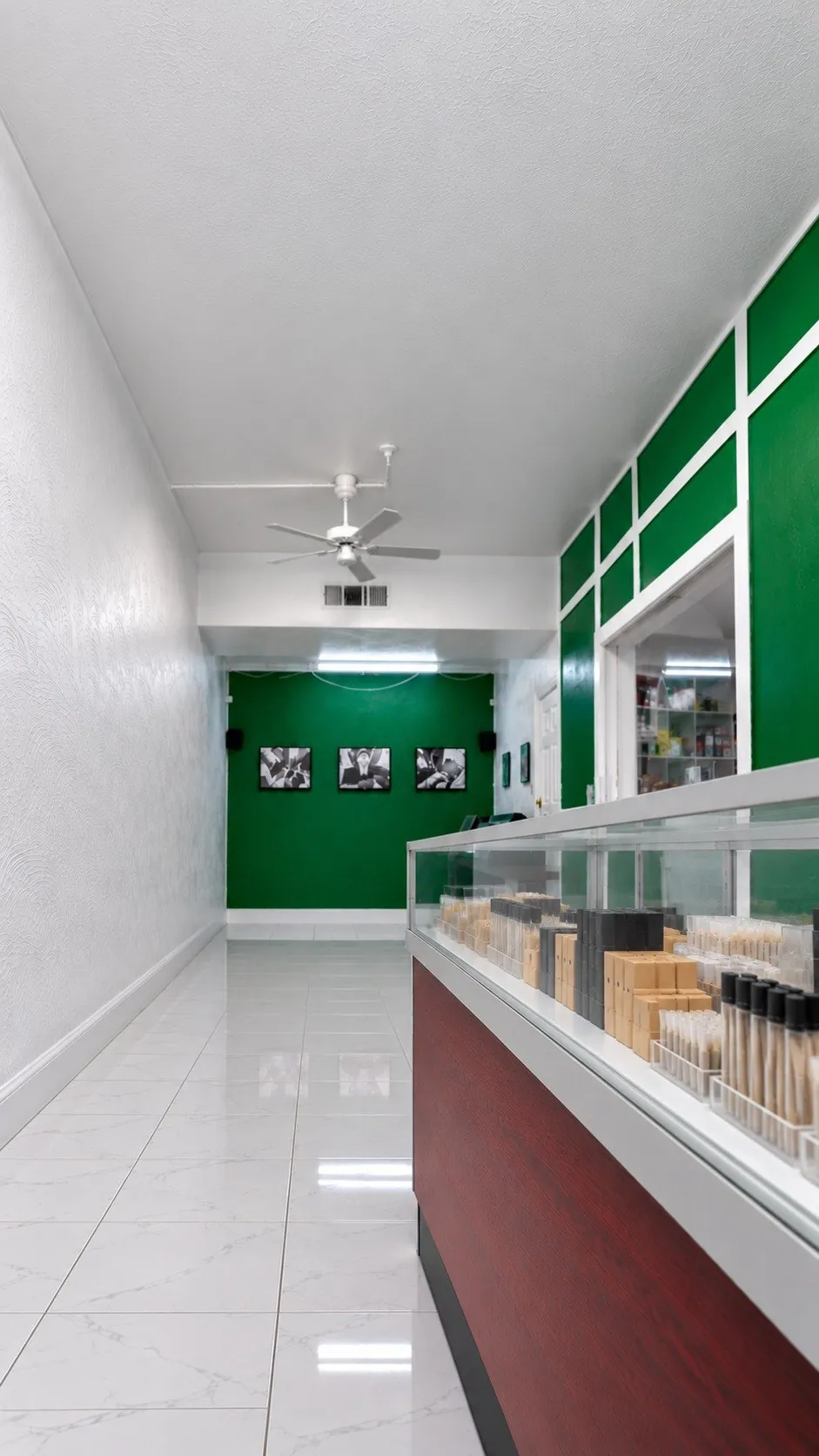Pre-roll tubes and packs in a glass display case at Kush Kingdom