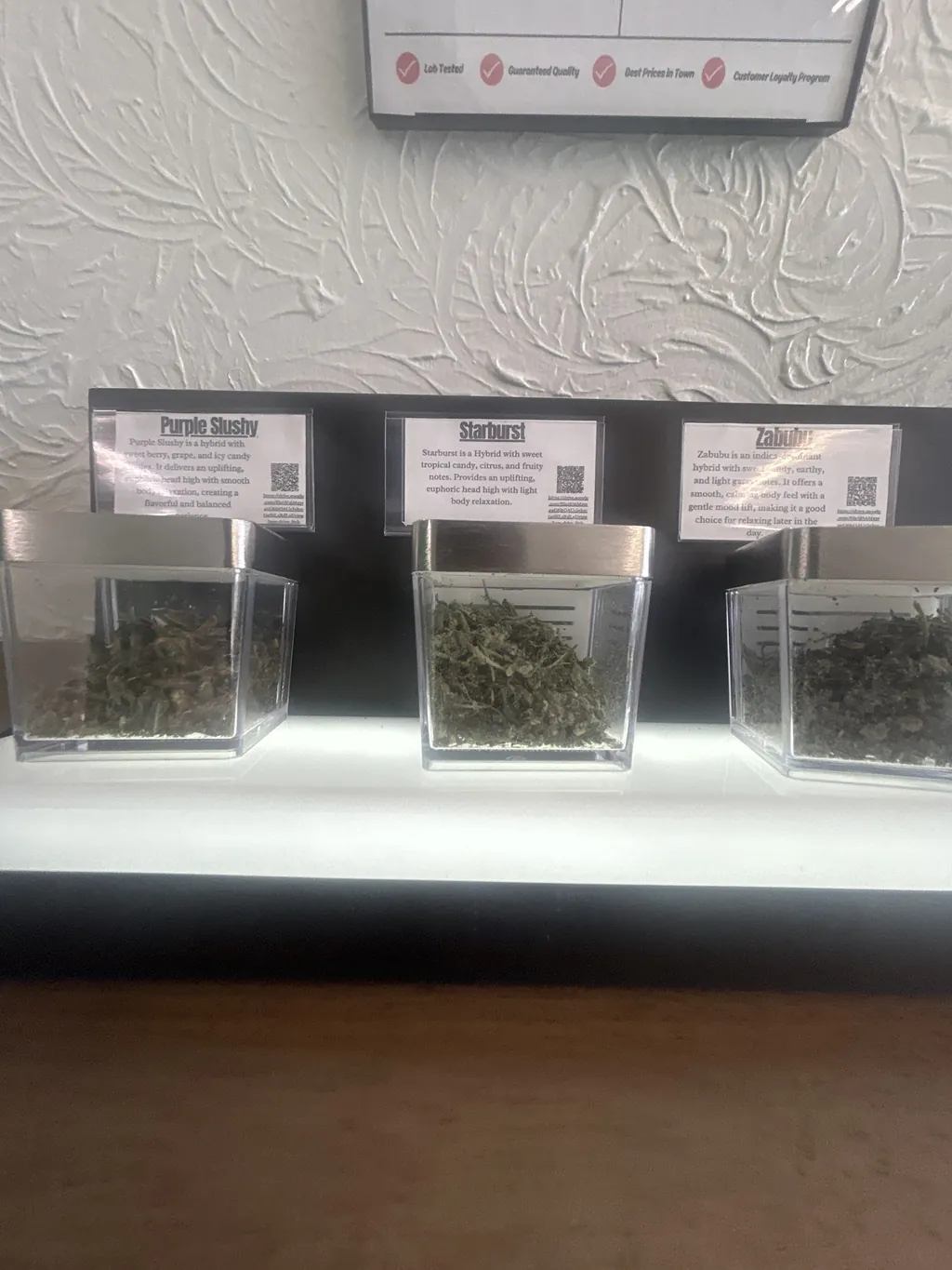 Display cases with product samples at Kush Kingdom