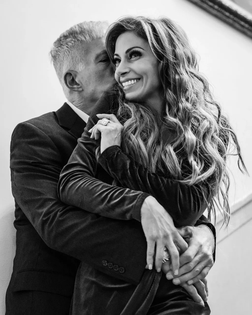 Black and white portrait of an older couple embracing